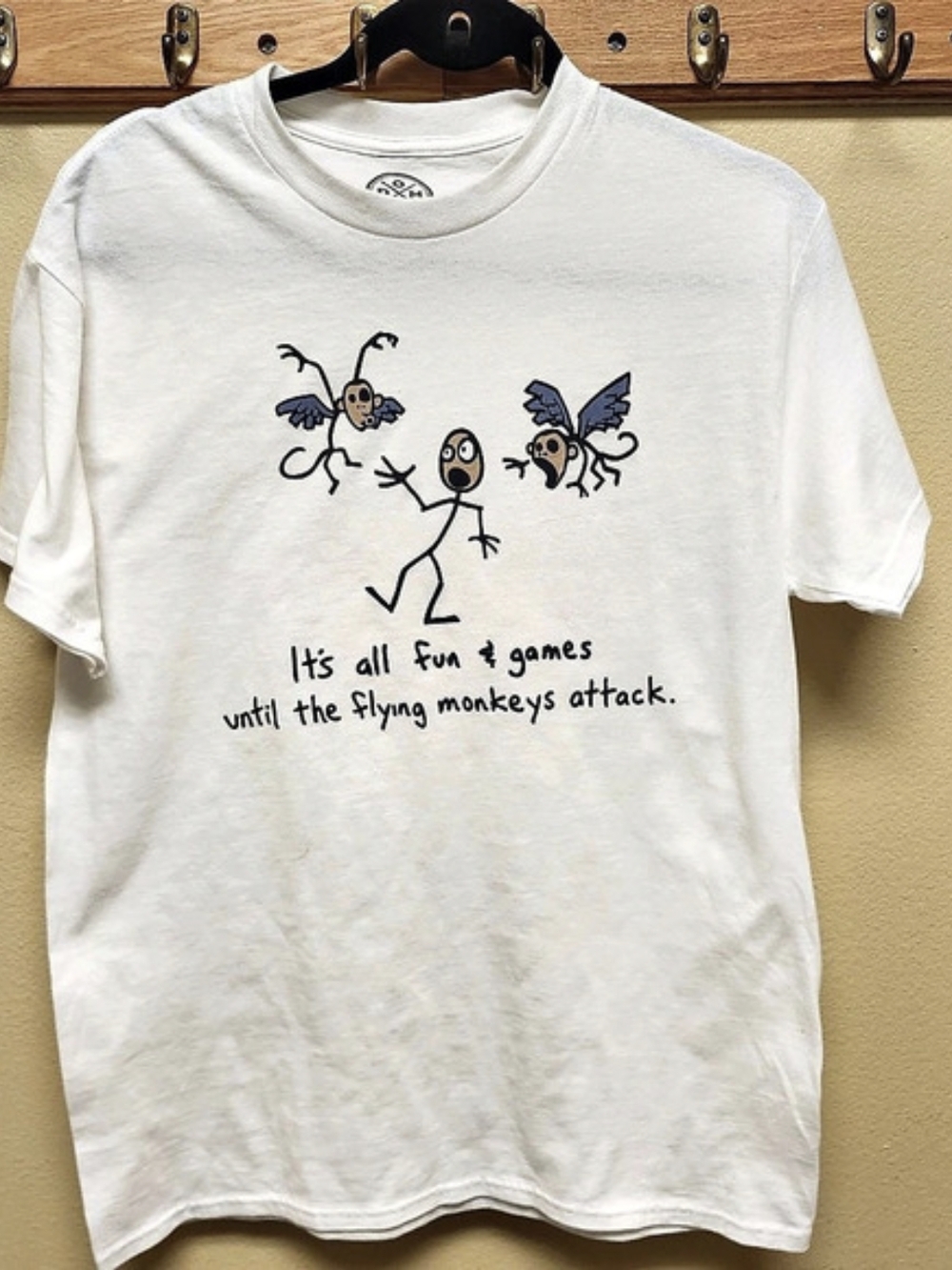 It's All Fun & Games Until The Flying Monkeys Attack Graphic T-Shirt in White